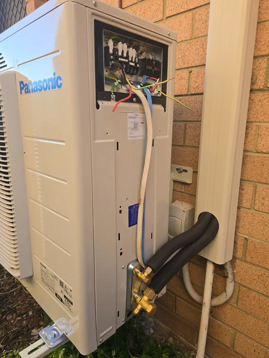 Outdoor Panasonic air conditioning unit during installation